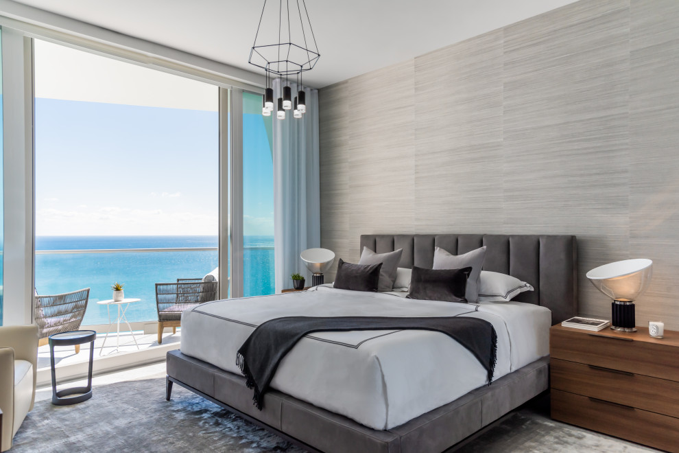 Design ideas for a contemporary guest bedroom in Miami with grey walls, no fireplace, grey floors and wallpapered walls.