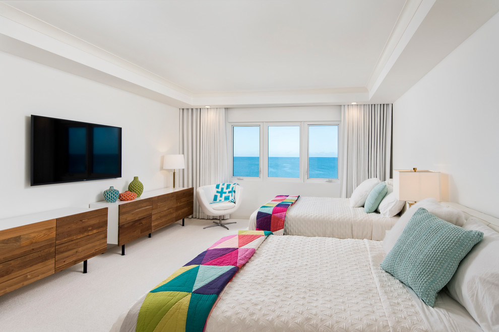Example of a trendy guest carpeted bedroom design in Miami with white walls