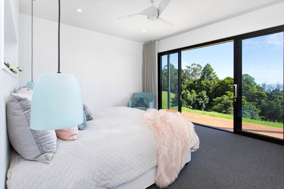 Design ideas for a contemporary master bedroom in Wollongong with white walls, carpet and grey floors.