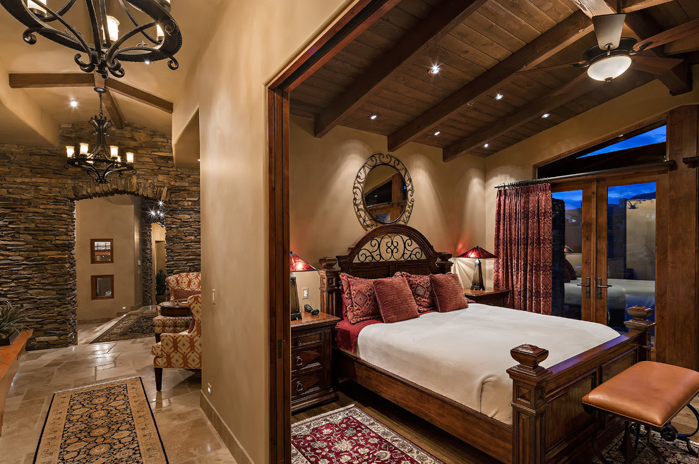 Rustic bedroom in Phoenix with brown walls and dark hardwood flooring.