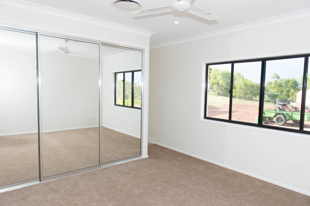Design ideas for a medium sized classic master bedroom in Brisbane with white walls and carpet.