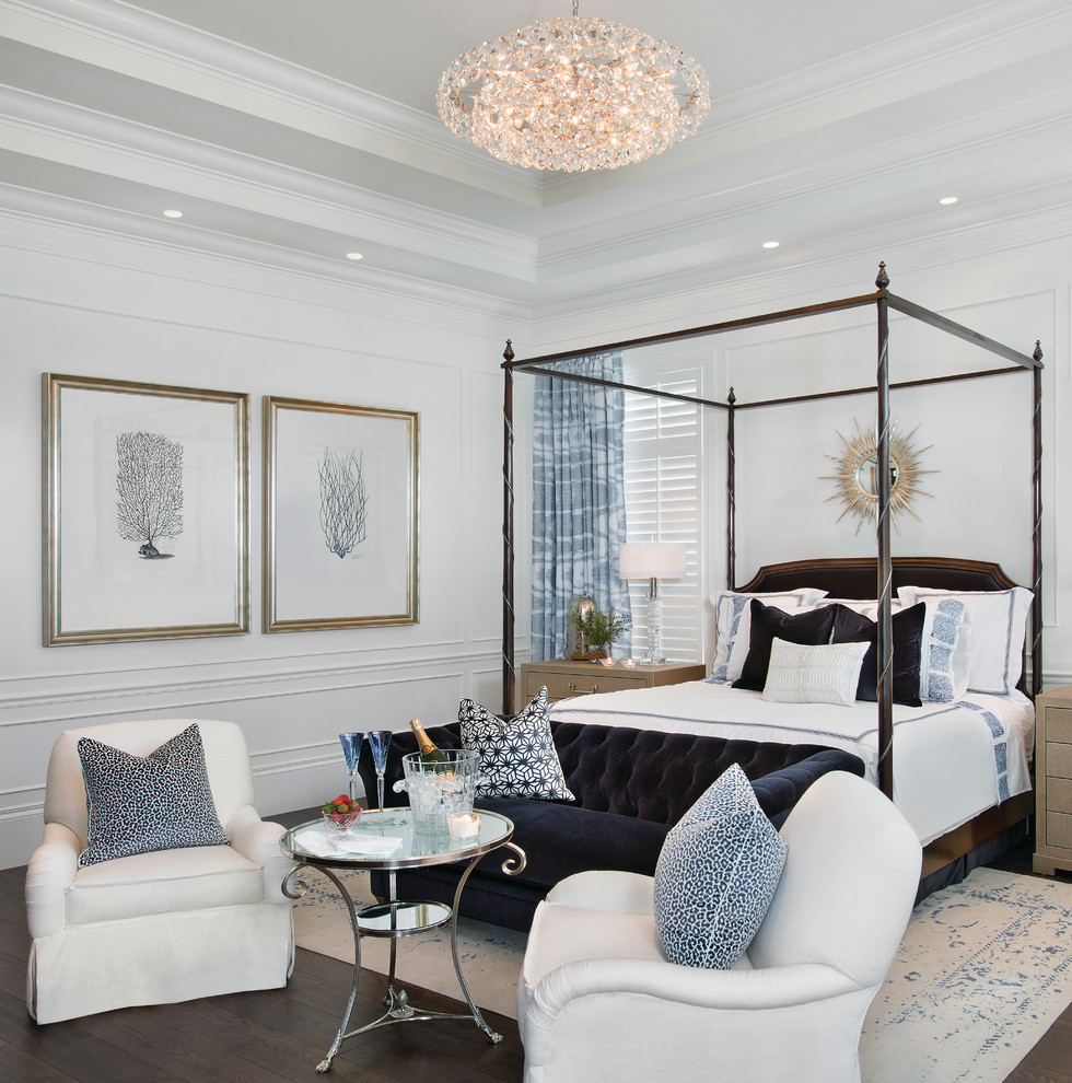 Design ideas for a master bedroom in Miami with white walls, dark hardwood flooring and feature lighting.
