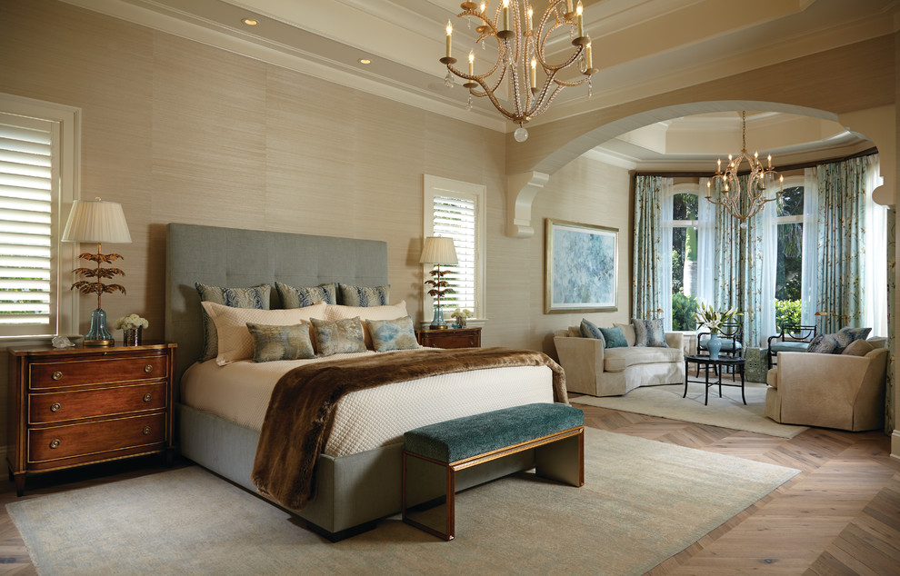 Master bedroom in Miami with beige walls and light hardwood flooring.