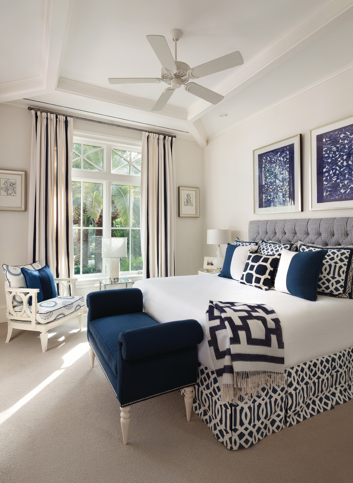 Inspiration for a transitional master carpeted bedroom remodel in Miami with beige walls