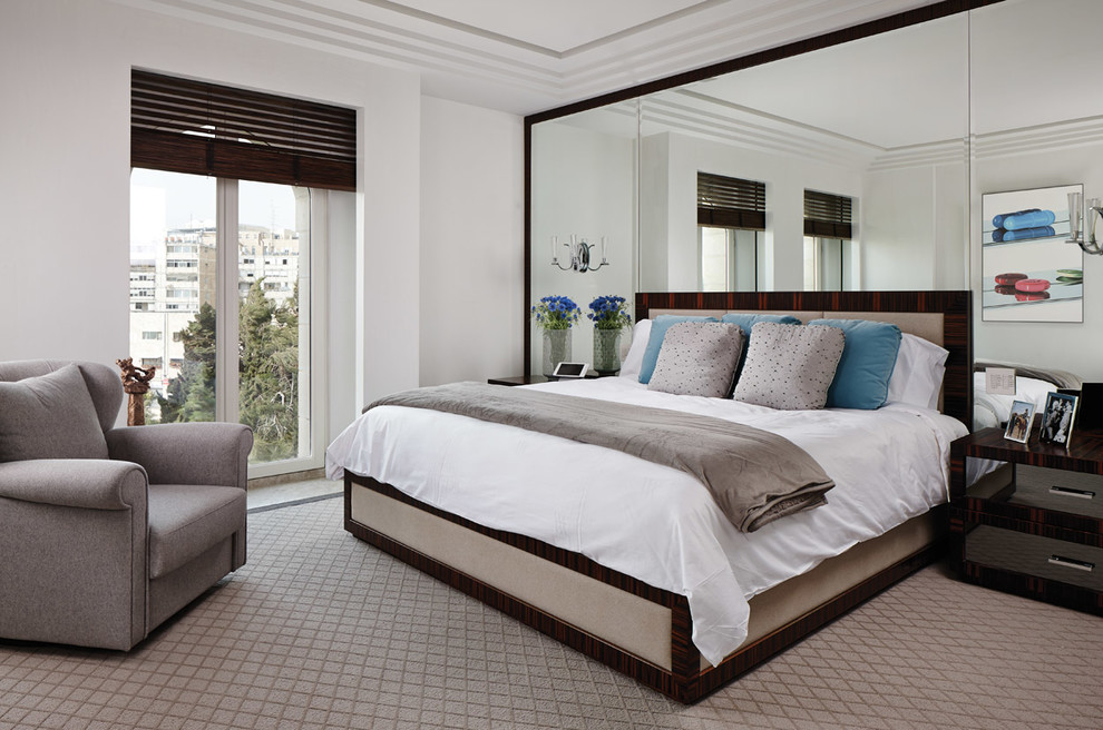 Photo of a contemporary master bedroom in New York with white walls.