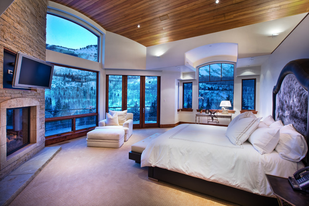 Inspiration for a traditional bedroom in Denver with white walls and carpet.