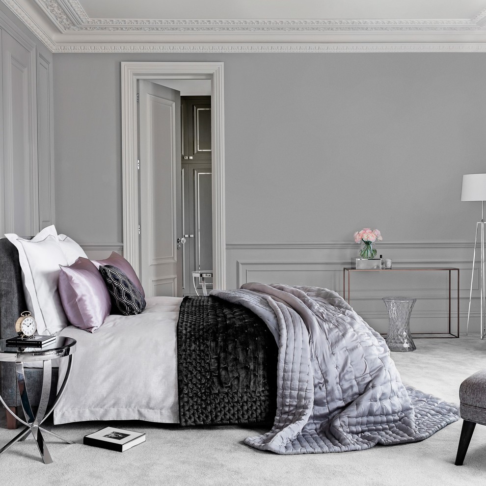 Photo of a contemporary grey and silver bedroom in London.