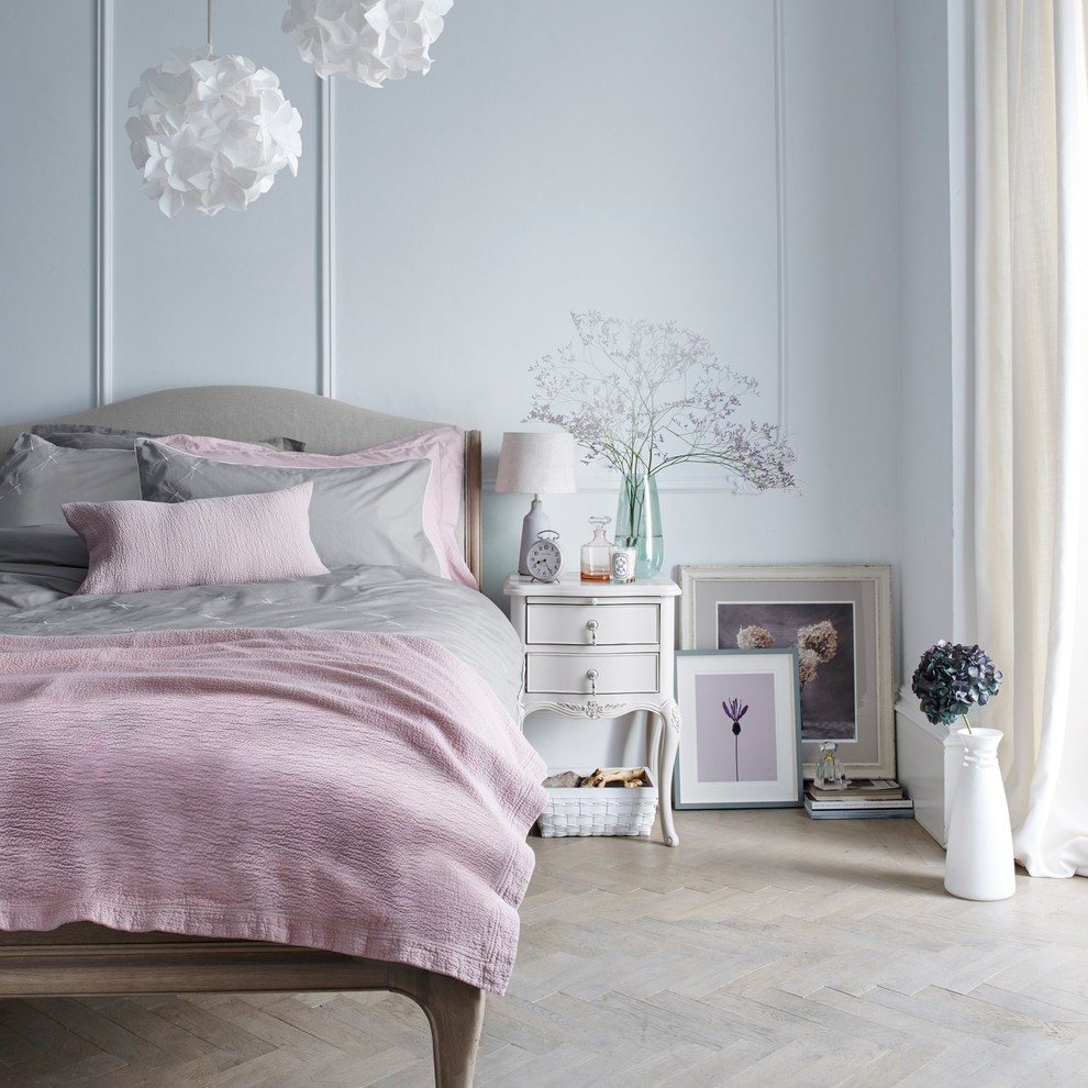 Photo of a classic grey and pink bedroom in London.