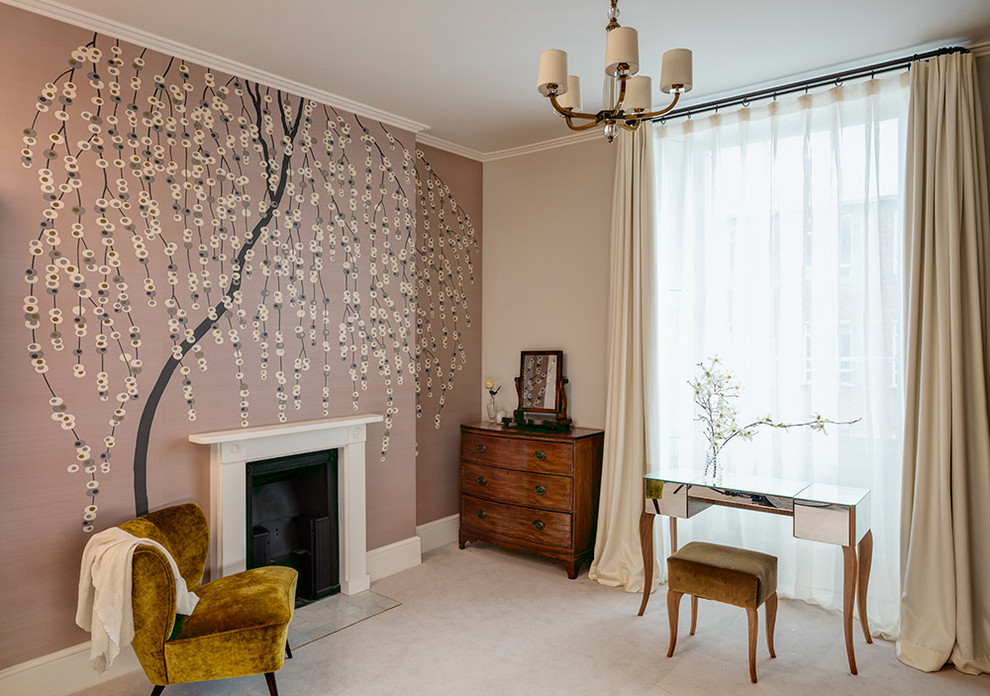 This is an example of a large classic guest bedroom in London with beige walls, carpet, a standard fireplace and a plastered fireplace surround.