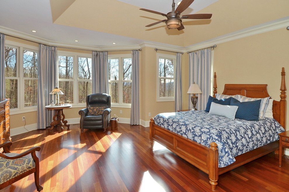 Large classic master bedroom in Other with black walls, medium hardwood flooring, no fireplace and brown floors.