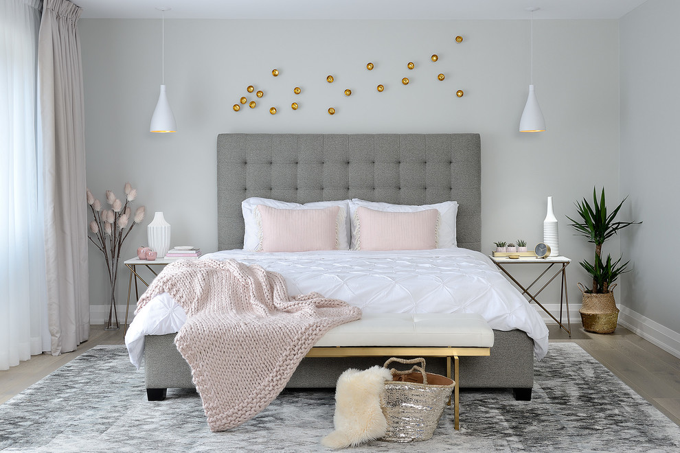 Inspiration for a classic grey and pink bedroom in Toronto with grey walls, light hardwood flooring and no fireplace.