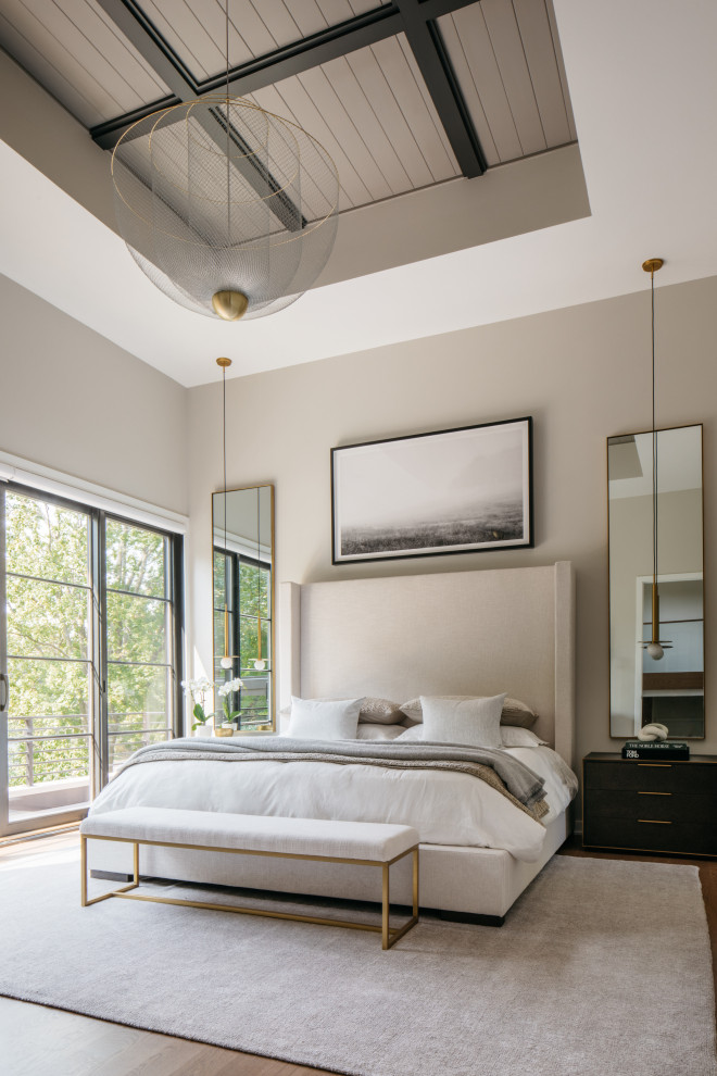 Inspiration for a contemporary medium tone wood floor, brown floor and tray ceiling bedroom remodel in Chicago with gray walls