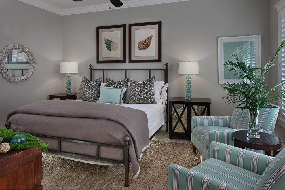 Design ideas for a large beach style master bedroom in Miami with grey walls and no fireplace.