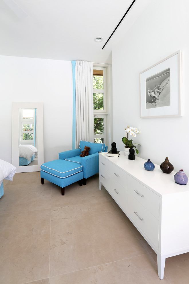 This is an example of a medium sized contemporary bedroom in Miami with white walls, limestone flooring, no fireplace and beige floors.