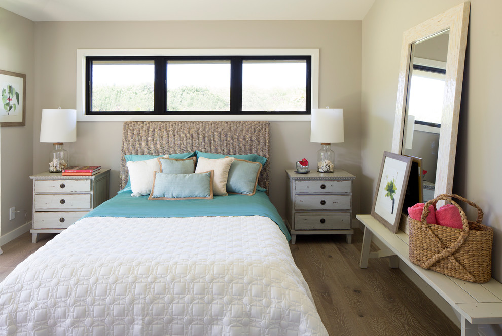 World-inspired guest bedroom in Hawaii with beige walls.