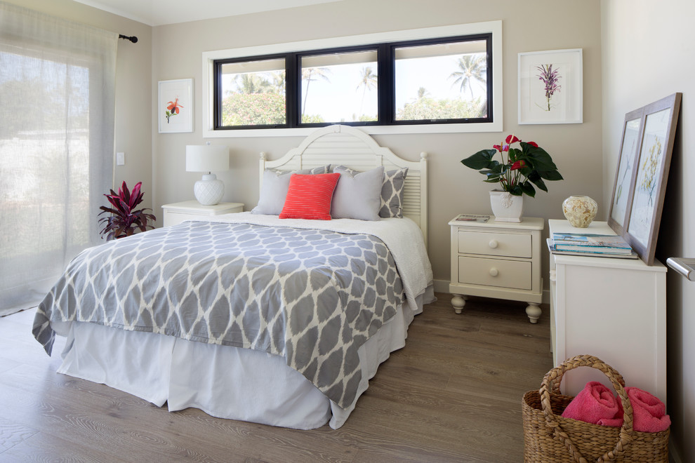 Example of an island style guest bedroom design in Hawaii with beige walls