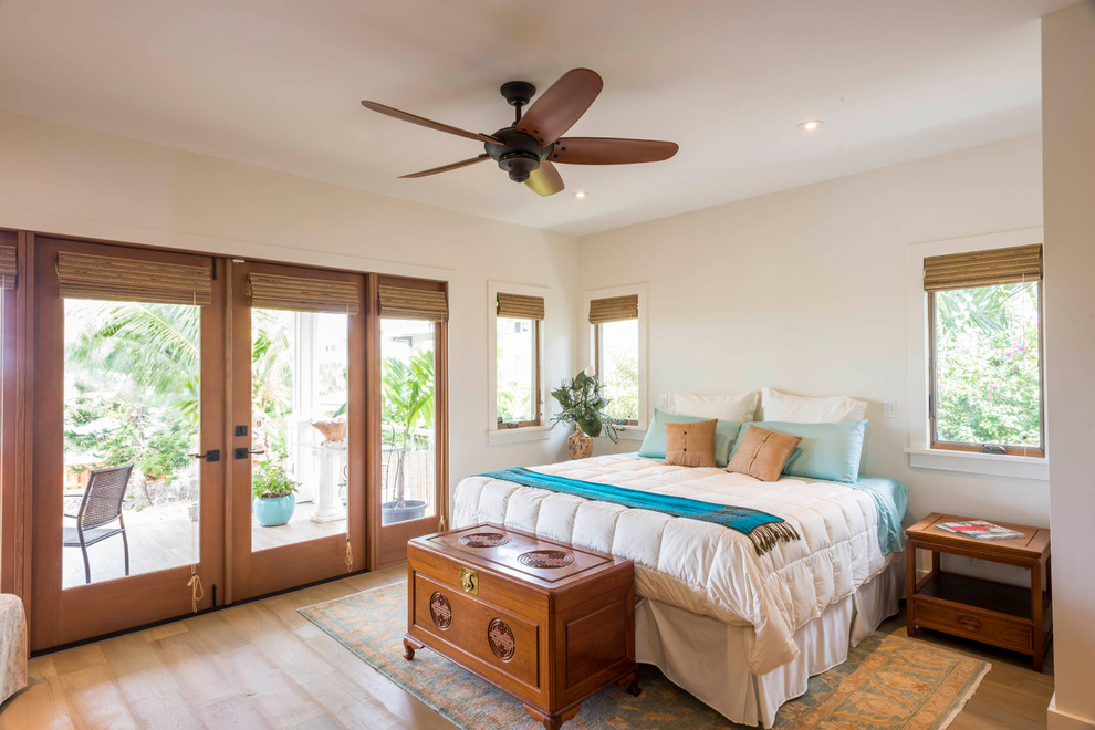 Design ideas for a world-inspired bedroom in Hawaii with white walls and dark hardwood flooring.