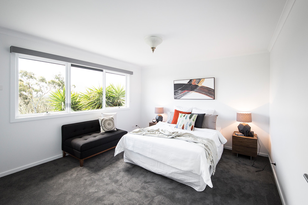 Contemporary bedroom in Melbourne with white walls, carpet and no fireplace.