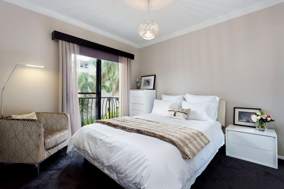Ejemplo de habitación de invitados actual de tamaño medio sin chimenea con paredes grises, moqueta y suelo negro