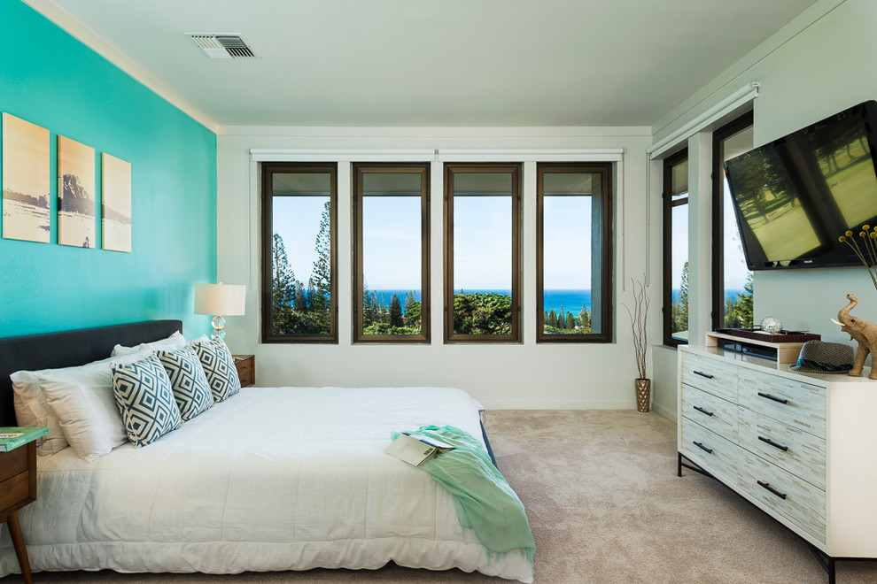 Photo of a beach style bedroom in Hawaii with white walls.