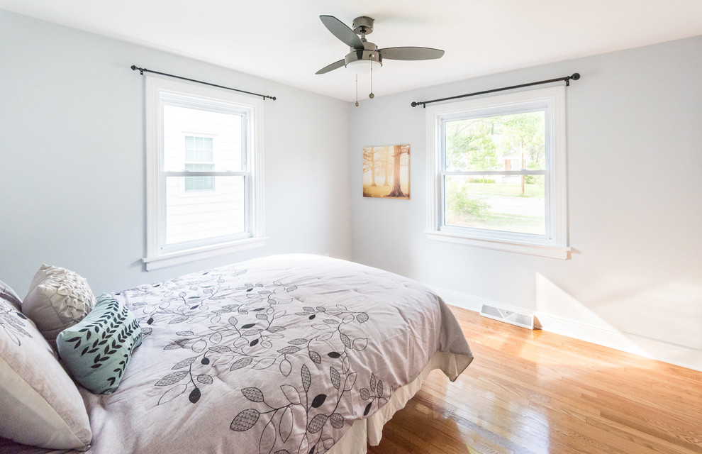 Photo of a medium sized contemporary guest bedroom in Wilmington with grey walls and light hardwood flooring.