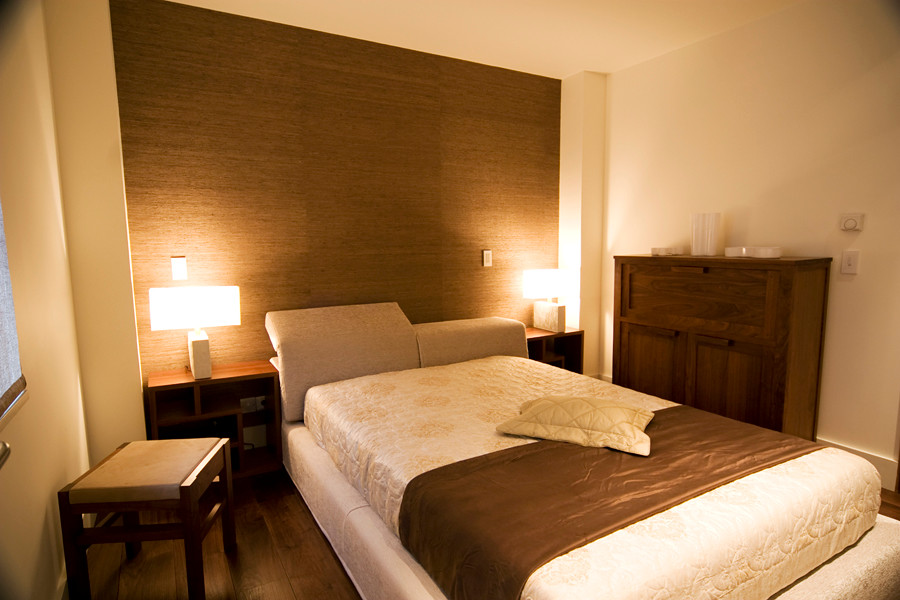 Bedroom - contemporary guest dark wood floor bedroom idea in London with brown walls
