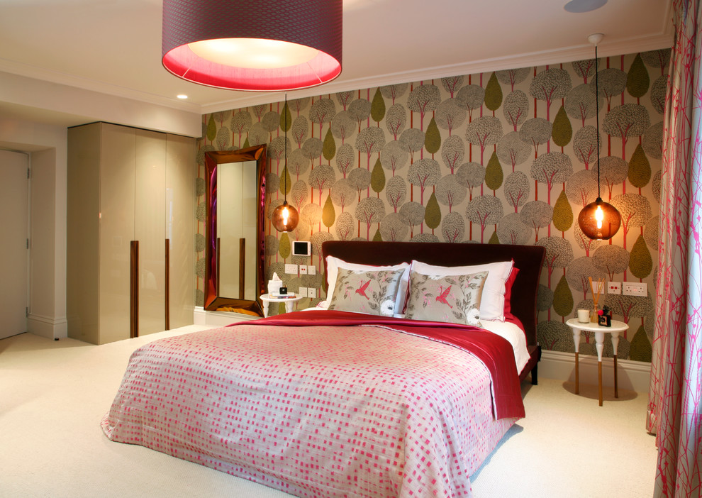 Trendy carpeted bedroom photo in London with multicolored walls
