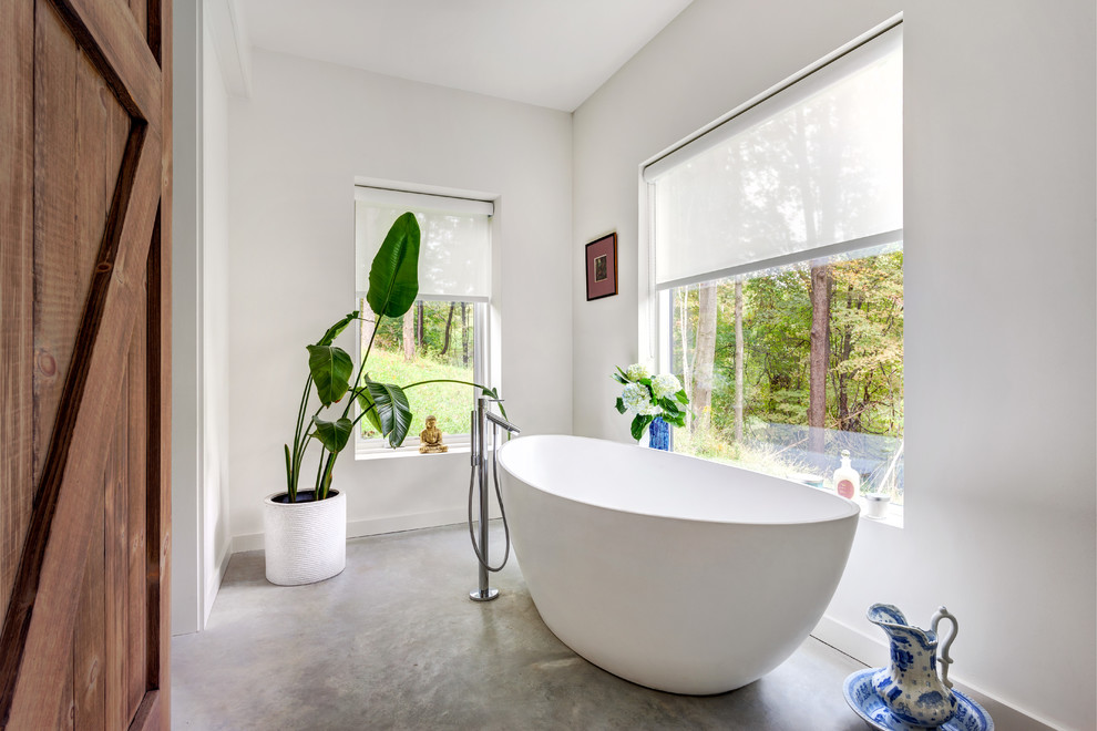 Bathroom - mid-sized modern concrete floor and gray floor bathroom idea in Bridgeport with white walls