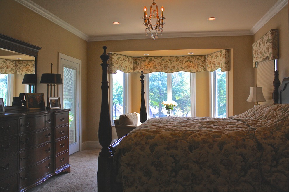 Bedroom - mid-sized traditional master carpeted bedroom idea in St Louis with beige walls