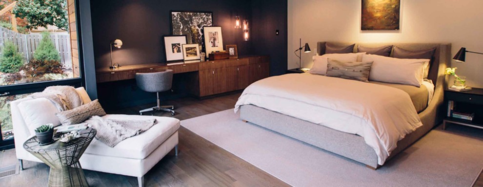 Medium sized modern master bedroom in Dallas with beige walls, medium hardwood flooring and brown floors.