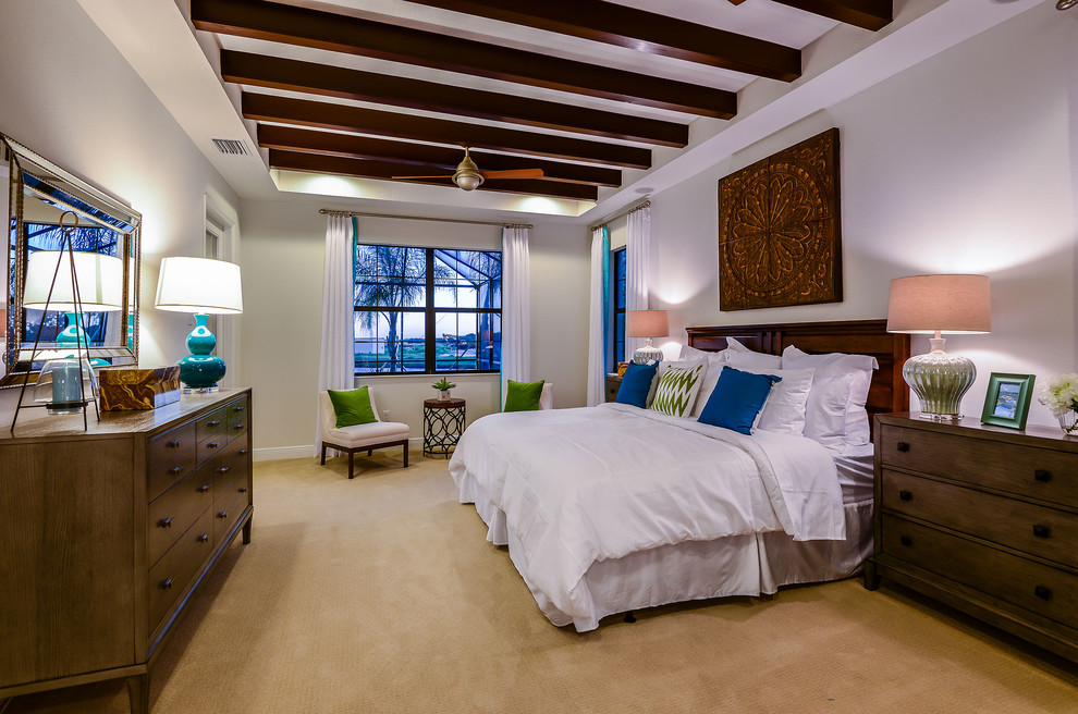 Mediterranean guest bedroom in Tampa with grey walls, carpet and no fireplace.