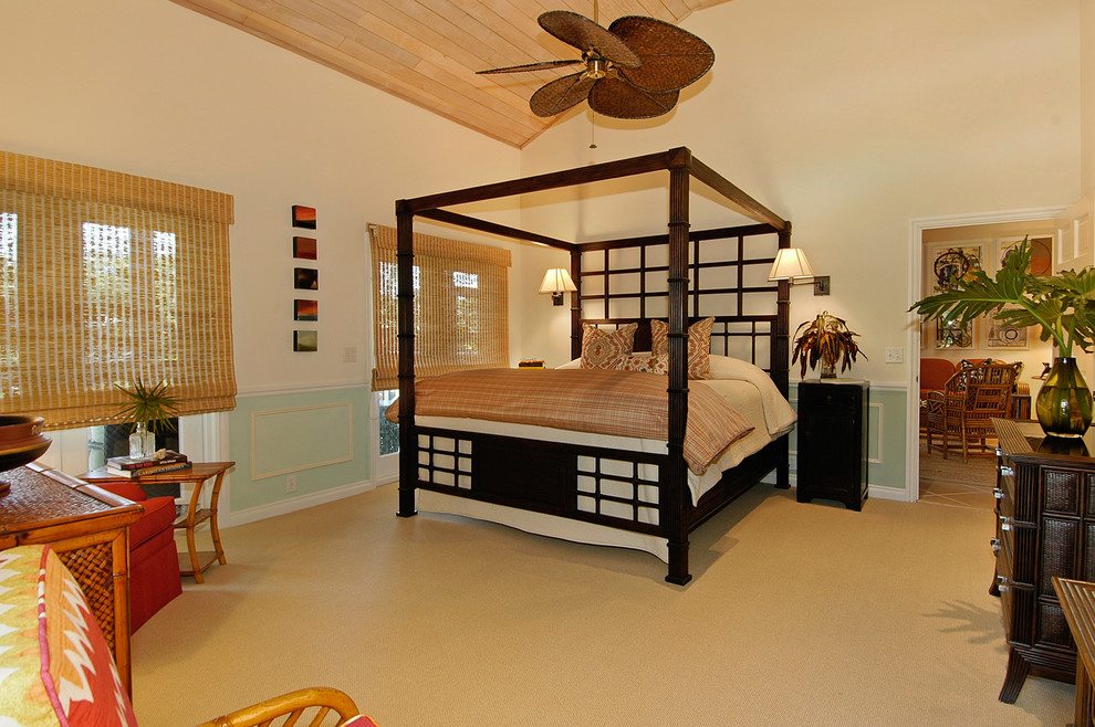 Large island style master carpeted and brown floor bedroom photo in Miami with beige walls and no fireplace