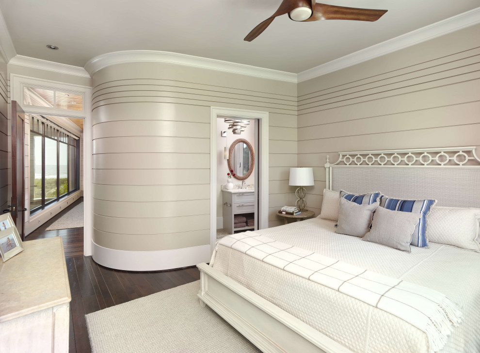 Photo of a nautical master bedroom in Charleston with beige walls, dark hardwood flooring, no fireplace and tongue and groove walls.
