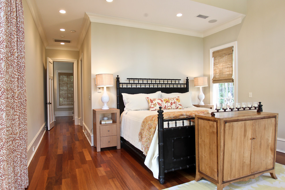 This is an example of a nautical bedroom in Charleston with beige walls and dark hardwood flooring.