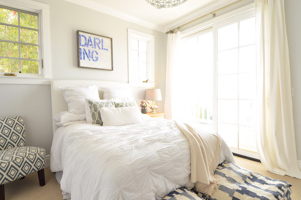 Inspiration for a coastal bedroom in San Diego with grey walls and carpet.