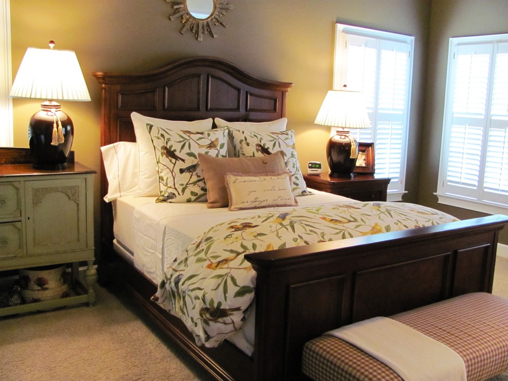 Elegant master carpeted bedroom photo in Atlanta with beige walls