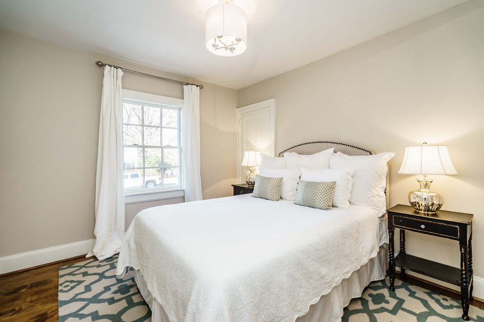 Design ideas for a medium sized traditional master bedroom in Raleigh with grey walls and medium hardwood flooring.