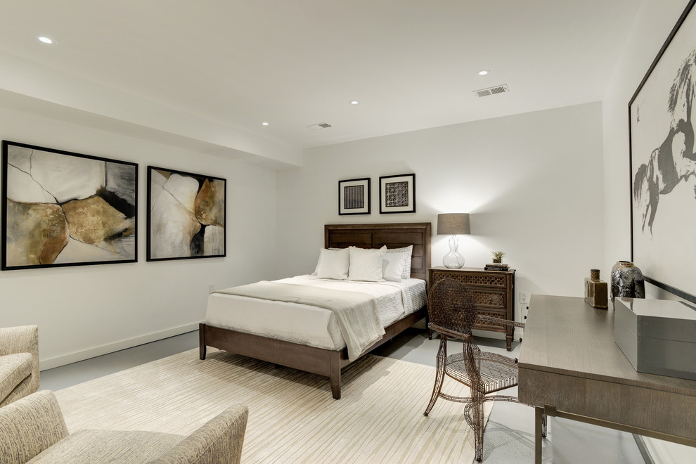 Modelo de habitación de invitados contemporánea de tamaño medio sin chimenea con paredes grises, suelo de cemento y suelo gris