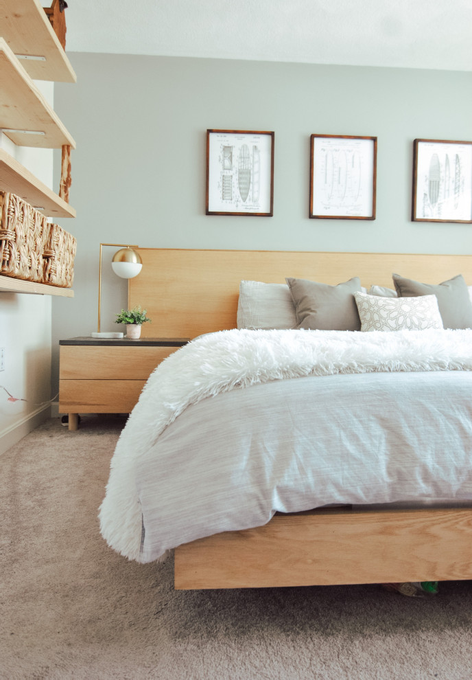 Imagen de dormitorio principal moderno de tamaño medio sin chimenea con paredes grises, moqueta y suelo gris