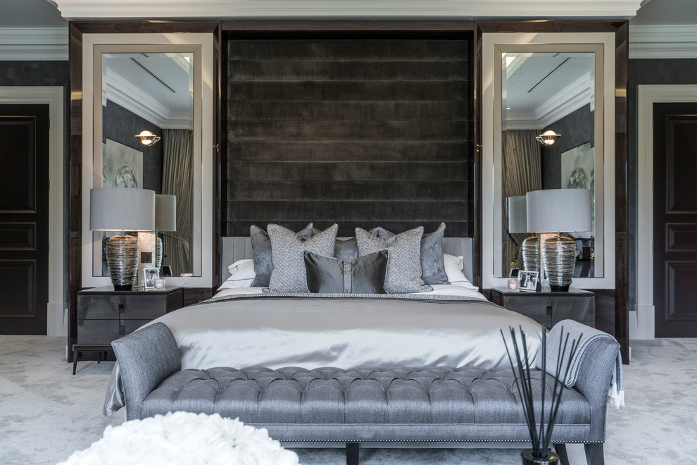 Immagine di una camera da letto design di medie dimensioni con moquette e pavimento grigio
