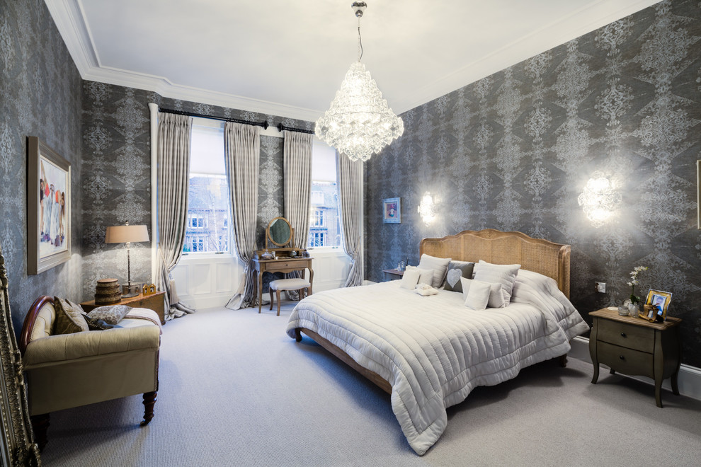 This is an example of a traditional bedroom in Glasgow with grey walls, carpet and grey floors.