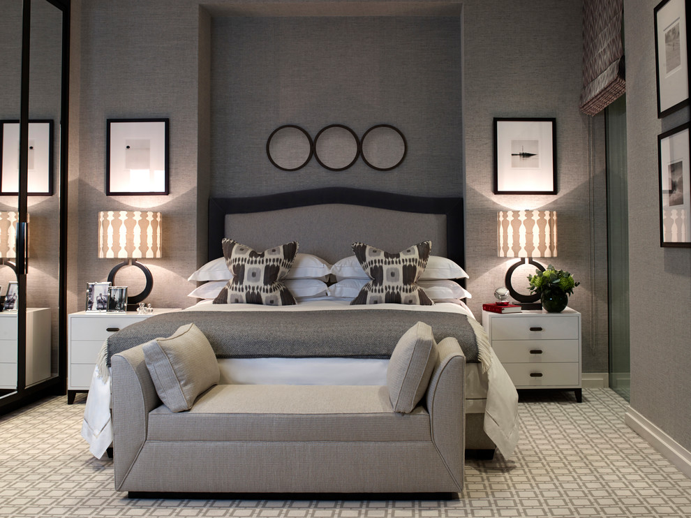 Large contemporary bedroom in London with grey walls, carpet, no fireplace and brown floors.