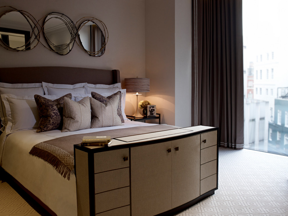 Photo of a large contemporary guest bedroom in London with beige walls, carpet, no fireplace and beige floors.