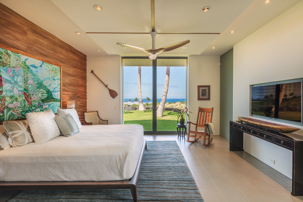 Medium sized world-inspired master bedroom in Hawaii with white walls, porcelain flooring, no fireplace and beige floors.