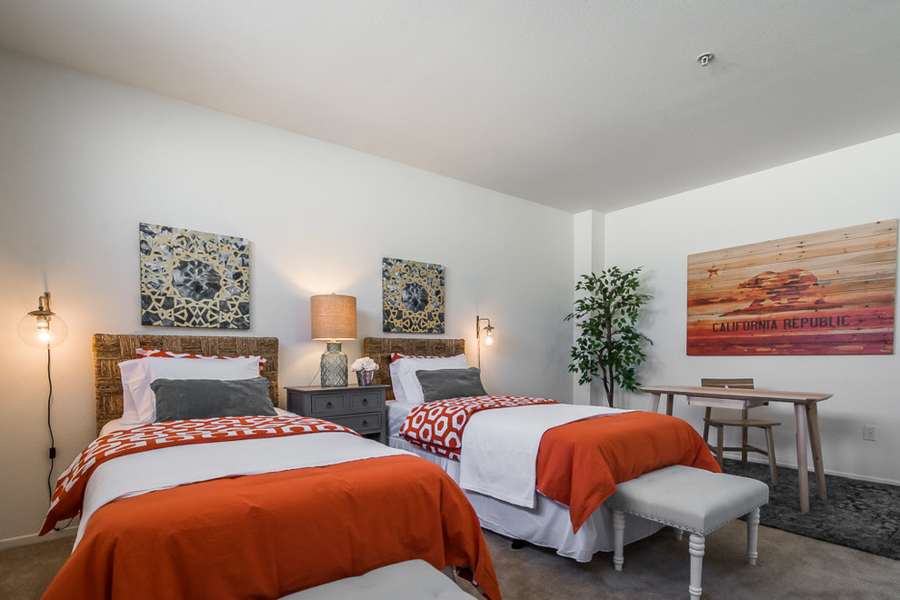 This is an example of a medium sized eclectic bedroom in San Diego with white walls, carpet and no fireplace.