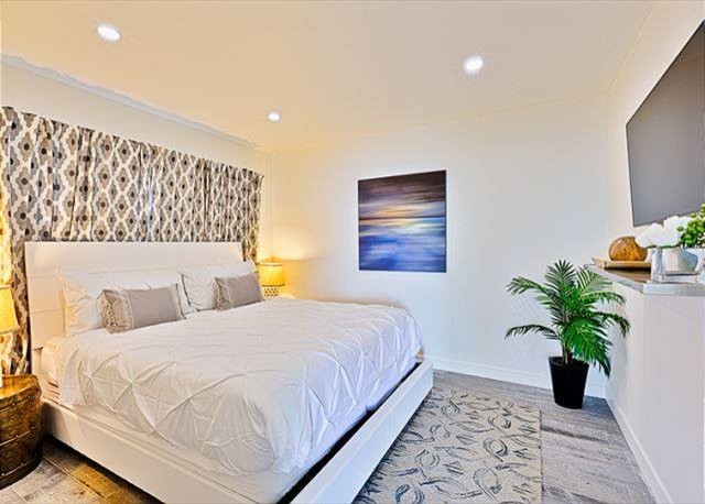 Bedroom - large coastal guest ceramic tile bedroom idea in San Diego with white walls and no fireplace