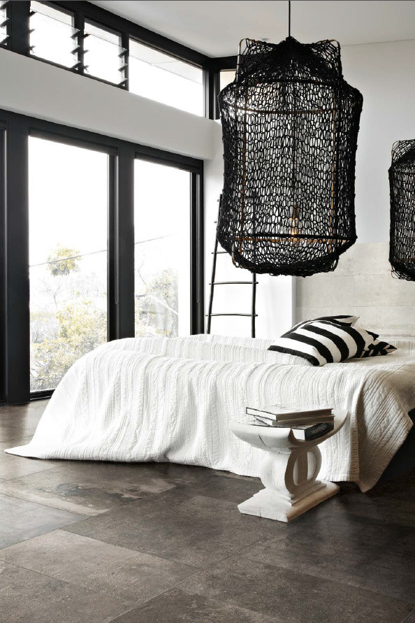 Ejemplo de dormitorio escandinavo con suelo de baldosas de porcelana