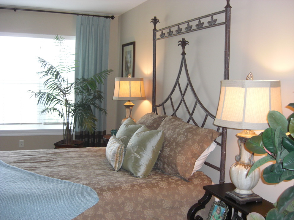Example of a transitional guest carpeted bedroom design in St Louis with beige walls and no fireplace