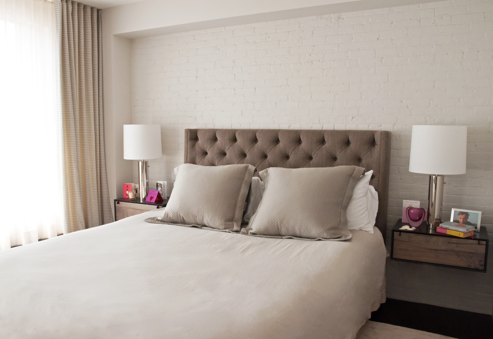 This is an example of an urban bedroom in New York with feature lighting.