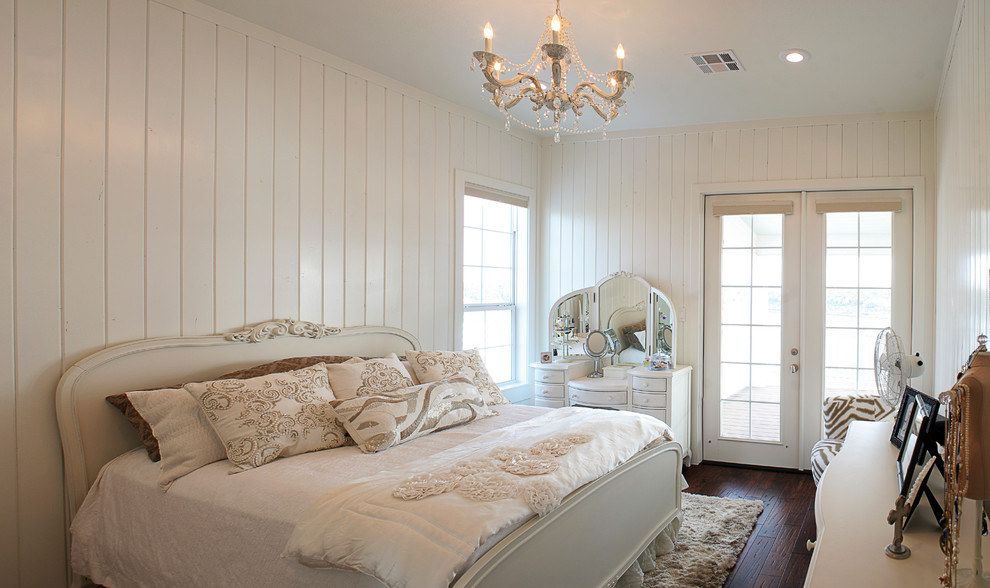 Inspiration for a shabby-chic style bedroom in Austin with white walls, dark hardwood flooring and no fireplace.